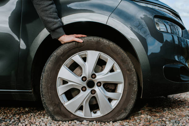 checking cars flat tire