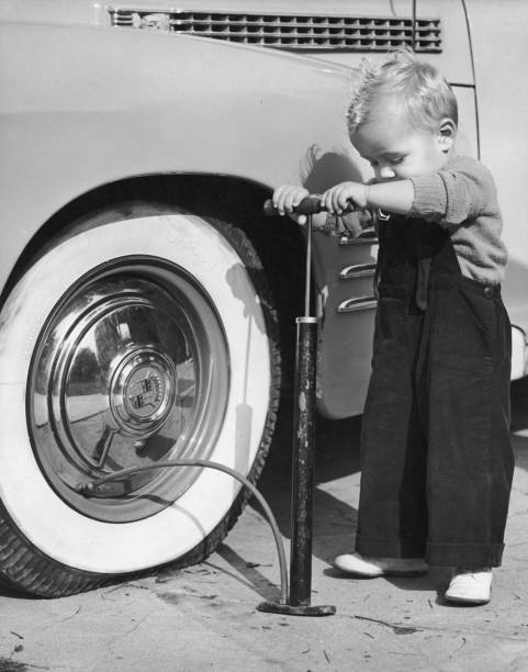 a child pumping vehicles tire