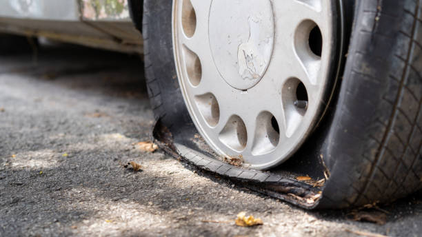 Flat tire of an old rusty car