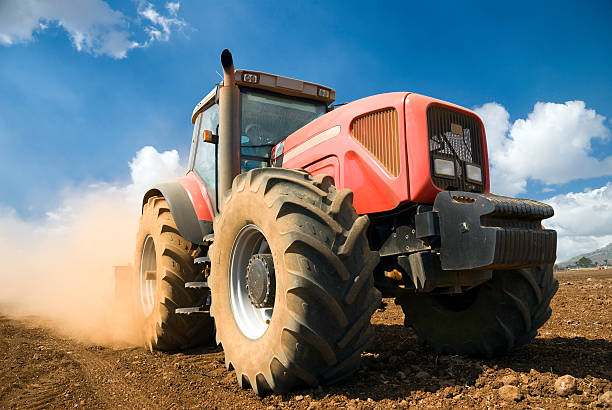 tractor working in sugar cane field